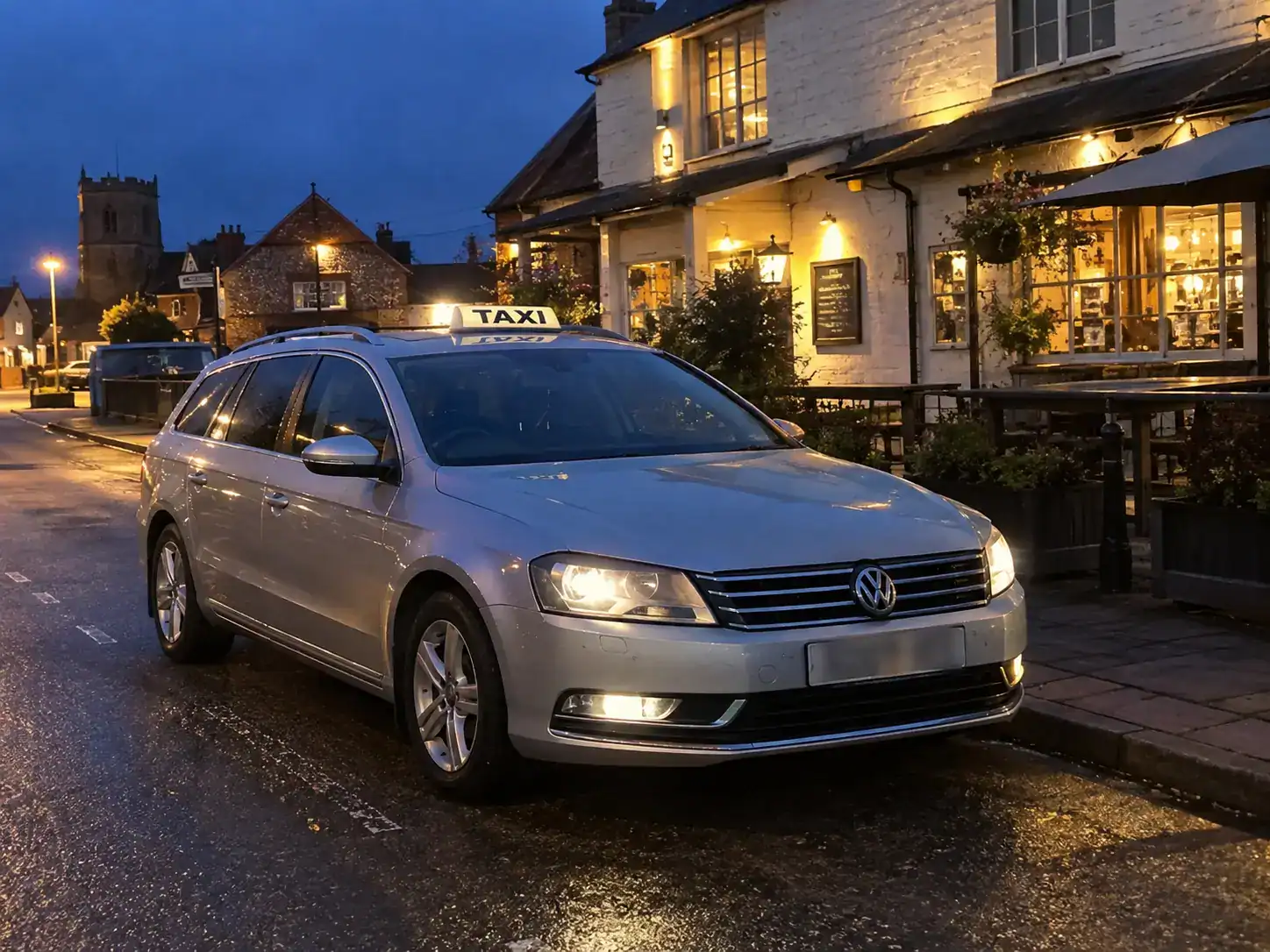 Silver VW Passat taxi outside a traditional Norfolk venue at night, representing Event Transport Service Downham Market and nearby villages.