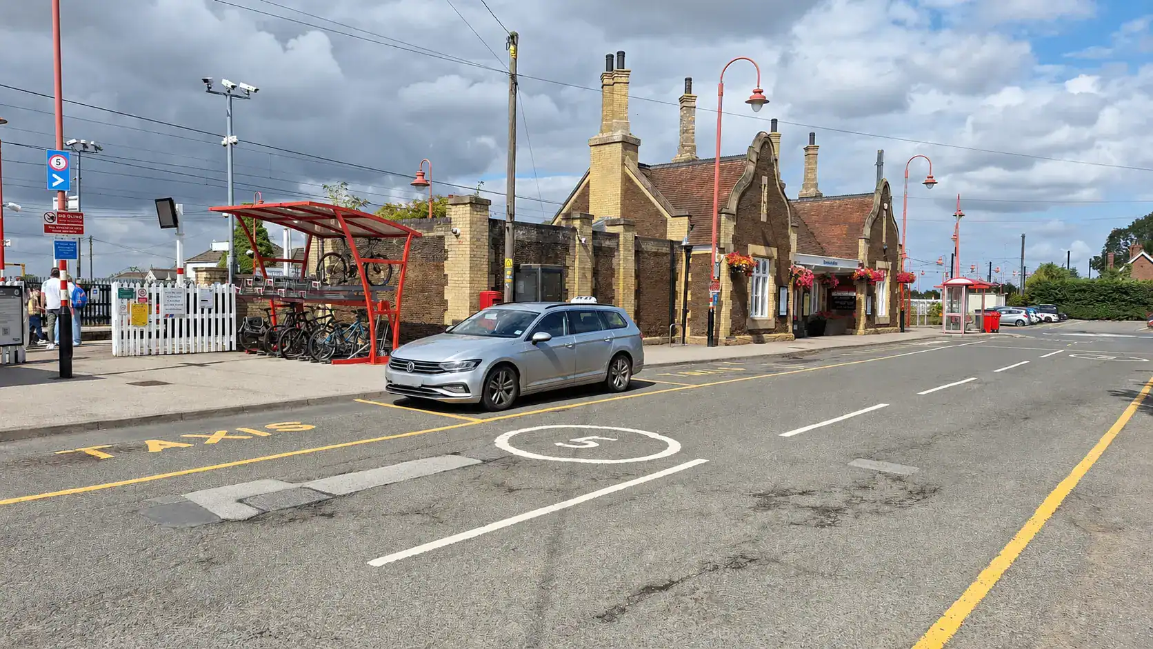 Silver G and M Taxis estate waiting outside Downham Market railway station for a Train Station Taxi in Downham Market booking.